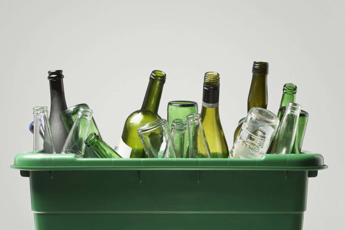 Empty bottles in green container; Shutterstock ID 145222138; purchase_order: 08 Jan 2021 issue; job: 08 Jan 2021 - Feature; client: Photo; other: