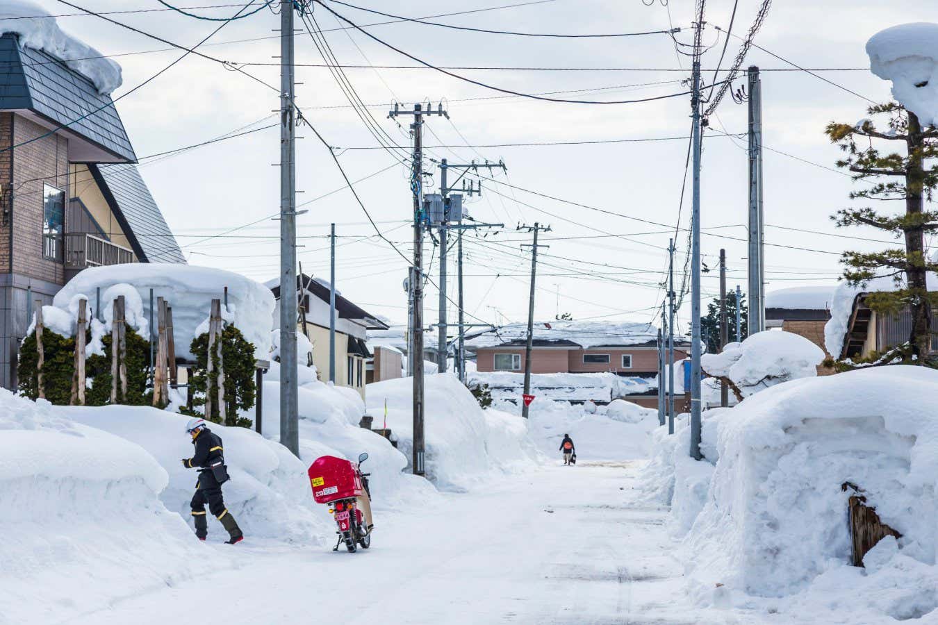 2N66J4J Postman with motorcycle, Life in a snow country, famous city by heavy snow, Yokote city, Akita, Tohoku, Japan, East Asia, Asia