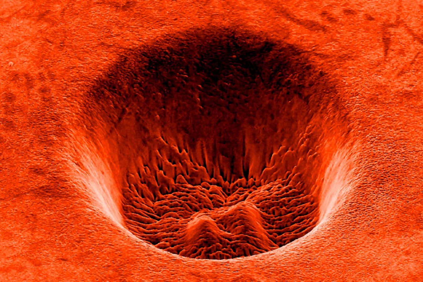 2WG3YFC Titanium crater formed by a laser, SEM