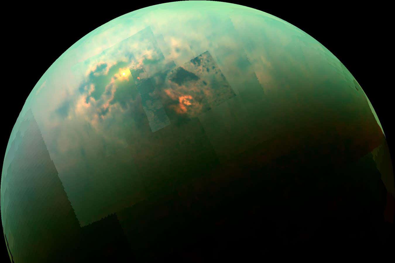 Titan as snapped by NASA's Cassini spacecraft showing the sun glinting off of the moon's north polar seas