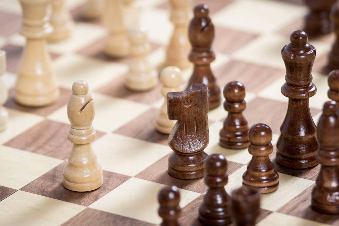 A chess board with a chess game being played