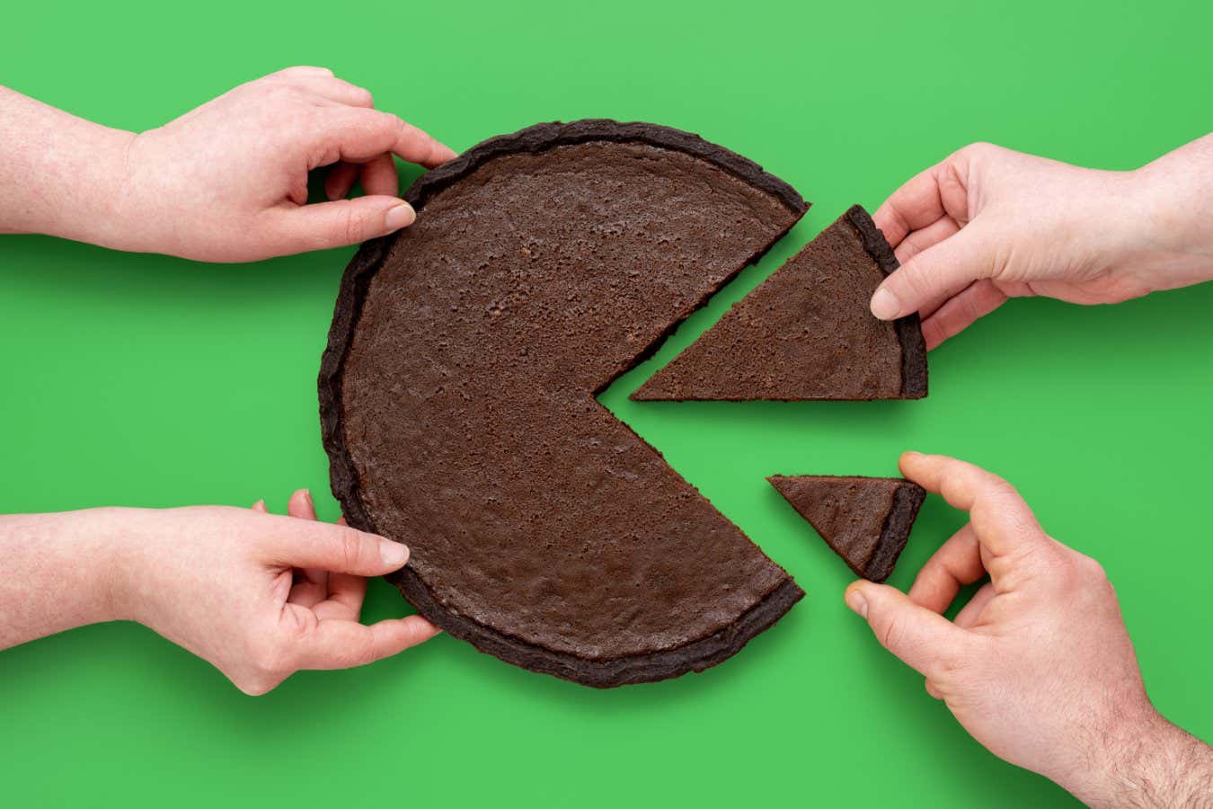 People hands taking slices of chocolate pie, above view on a green background. Unequal sharing the cake, concept for financial pie chart